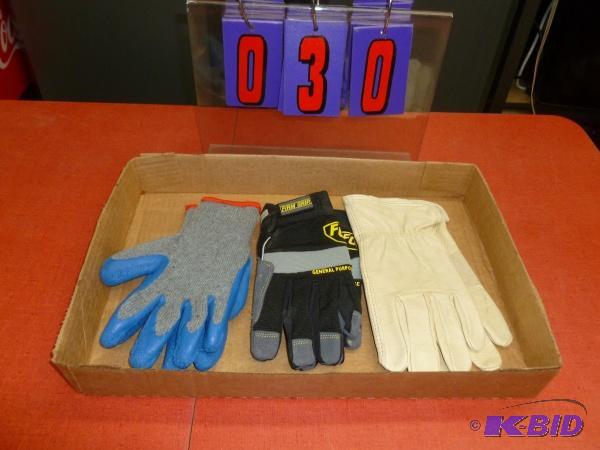 Flat of 3 pair size small and medium gloves. ...
