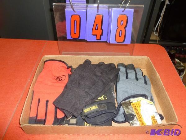 Flat of 4 pair of size large and xl gloves. A...