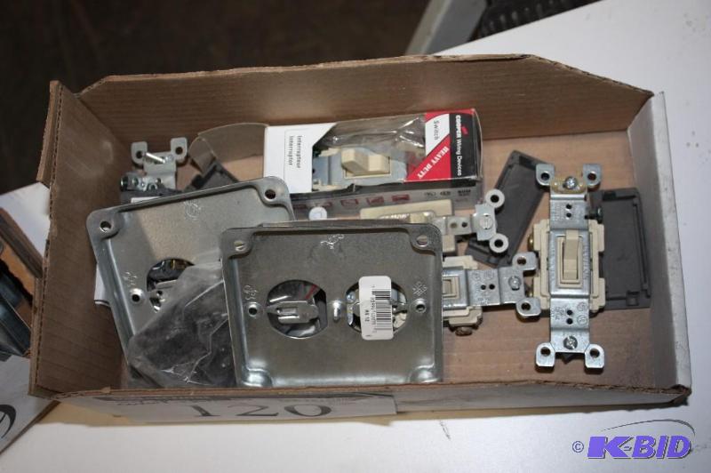 lot 120 image: Box Lot Including Light Switch CoversOutlet Covers, Plastic Light Switches wMetal Hanging Frame.