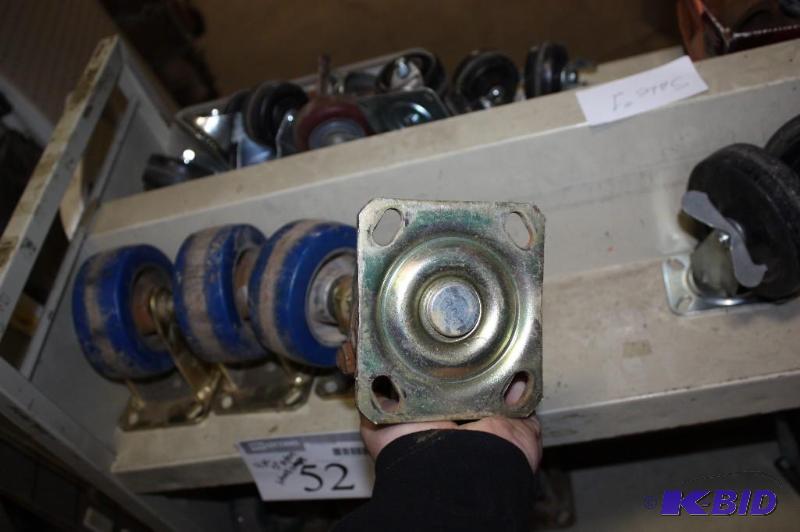 lot 52 image: (4) 5 Nylon Wheels w Attached Metal Frame Bracket.