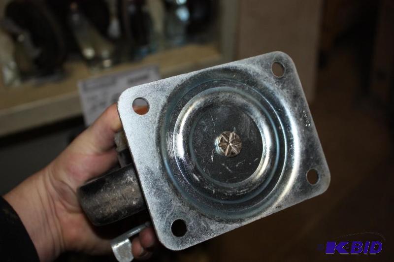 lot 56 image: Lot of (4) 4 Plastic Wheels wStop Locks & Attached Metal Frame Bracket.