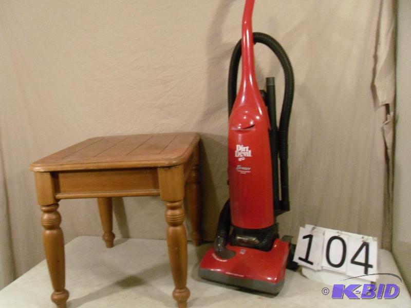 lot 104 image: Wood End Table and Dirt Devil Vacuum (needs b...