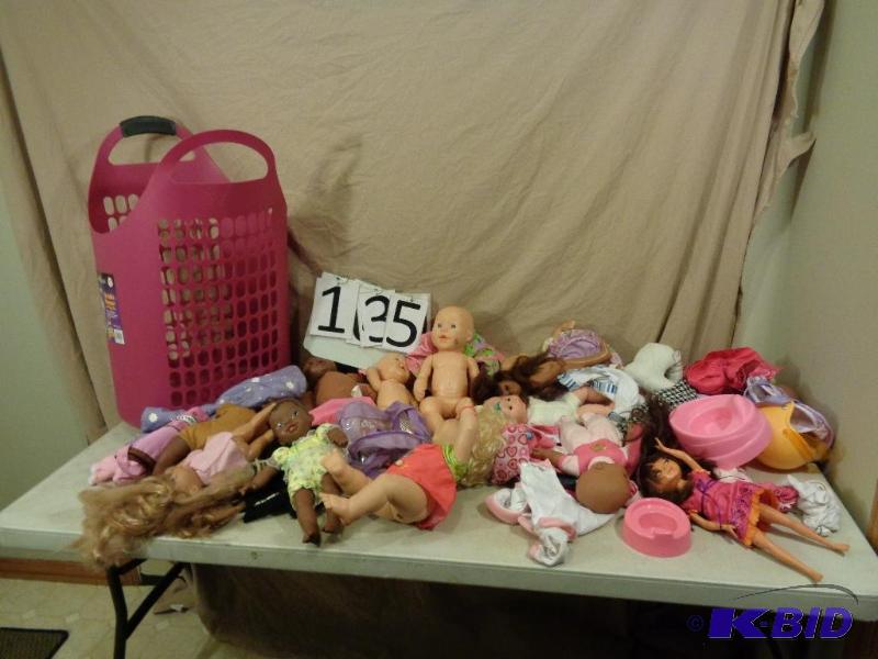 lot 135 image: Laundry basket full of girls toys. Dolls, dol...