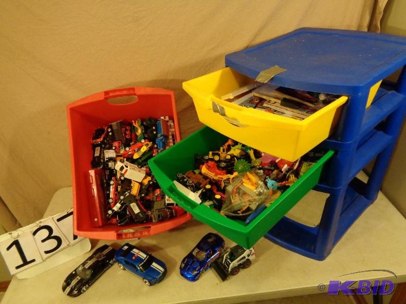 lot 137 image: 3 drawer cabinet full of toys. Trucks, cars, ...