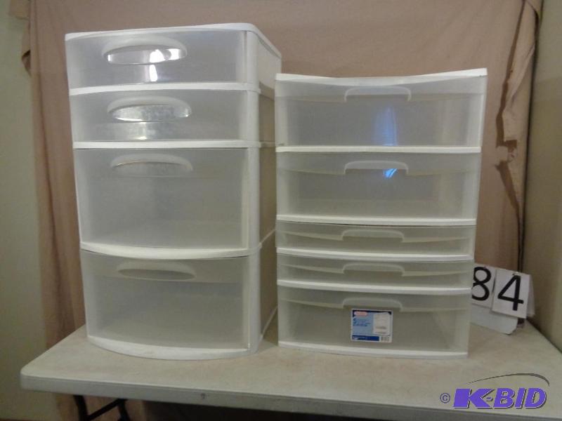 lot 184 image: 2 Plastic Storage Systems. One top is bent an...