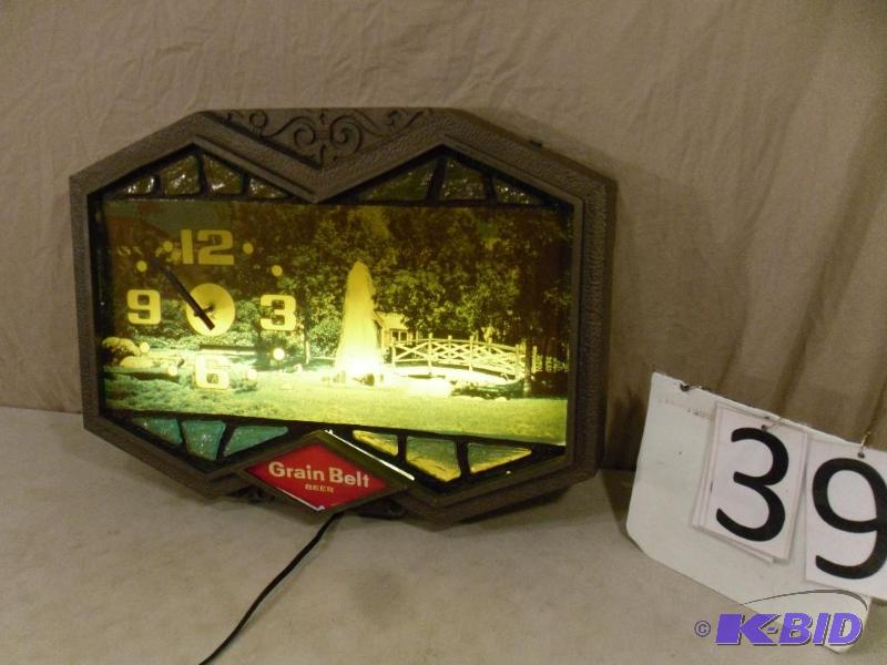 lot 39 image: Lighted Grain Belt Beer Clock. Needs backgrou...