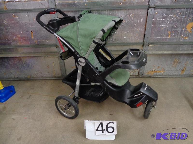 lot 46 image: Jeep Jogging Stroller. Needs a cleaning. Fold...