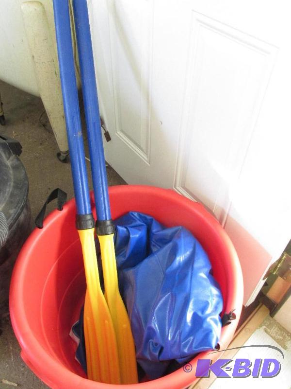 Huge Red Tub and a Blow-Up Boat with Oars