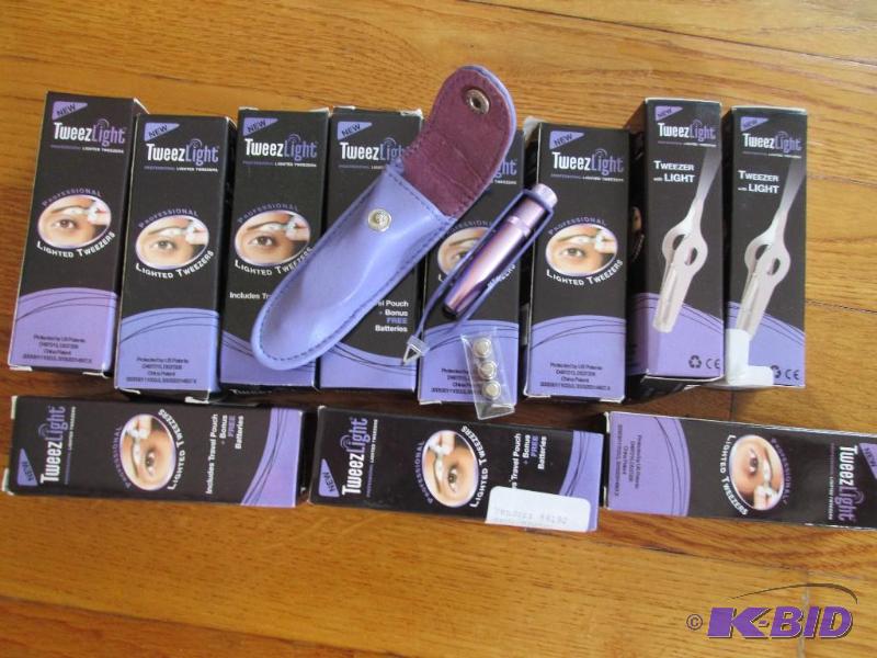 lot 116 image: Lot of 12 lighted tweezers in lavender case w...