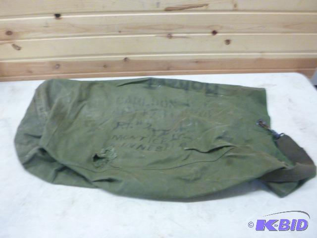lot 114 image: Military Duffel Bag Has small hole....
