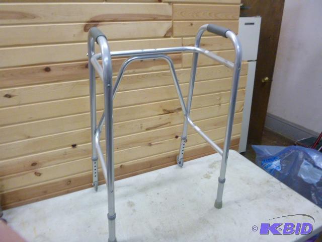 lot 210 image: Aluminum Walker With rear wheels....