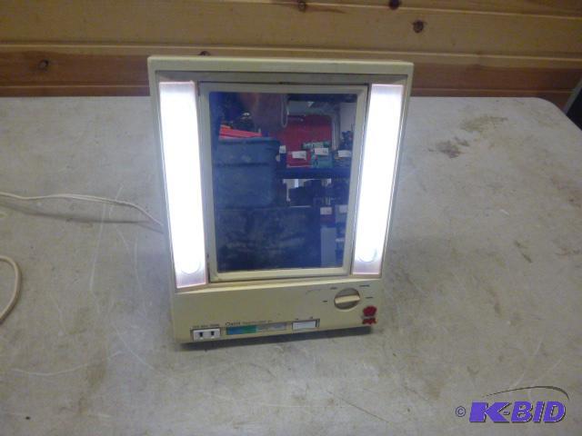 lot 60 image: Clairol True-to-Light Makeup Mirror...
