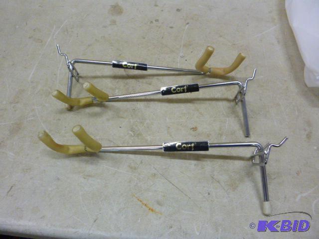 lot 72 image: Three Peg Board Instrument Hangers...