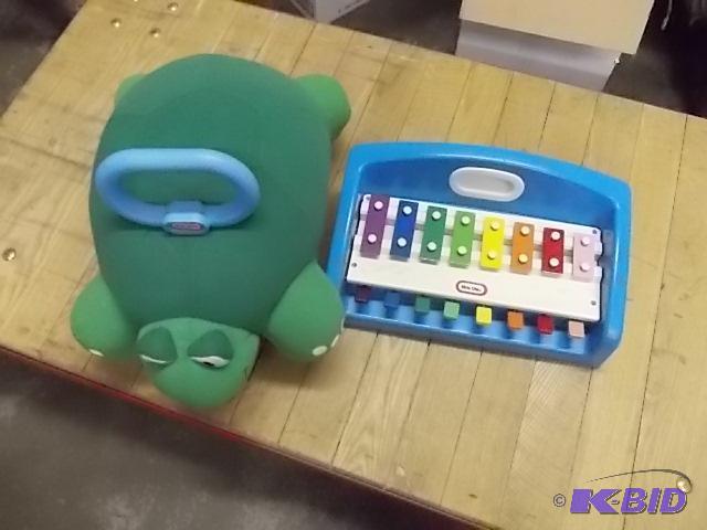 lot 29 image: Fisher Price Xylophone and Ride On Turtle...