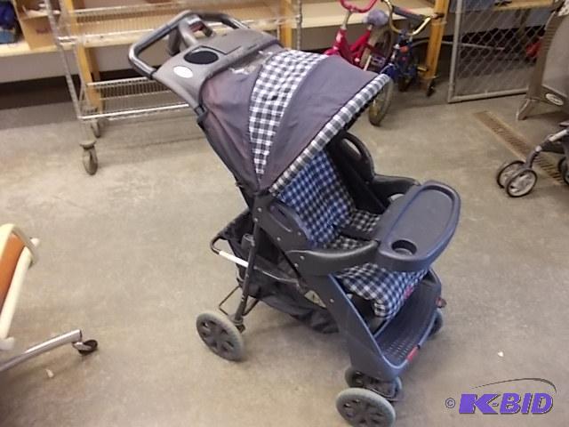 lot 6 image: Evenflo Stroller...