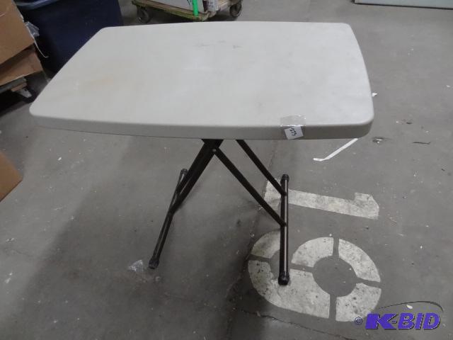 New 30 in x 19 in polyethyelene folding table...