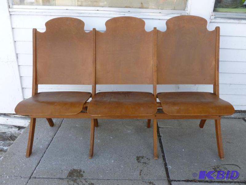 lot 1 image: A section of three vintage 1940s wooden thea...