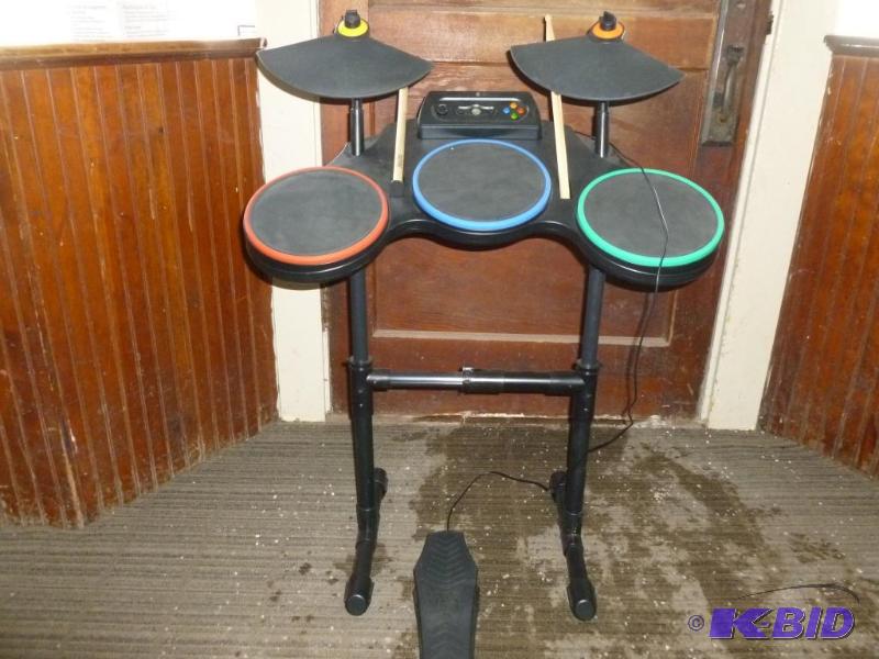 lot 12 image: X-Box Guitar Hero drum set that includes, sti...