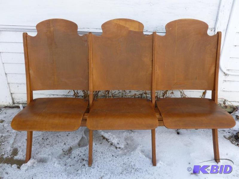 lot 2 image: A section of three vintage 1940s wooden thea...