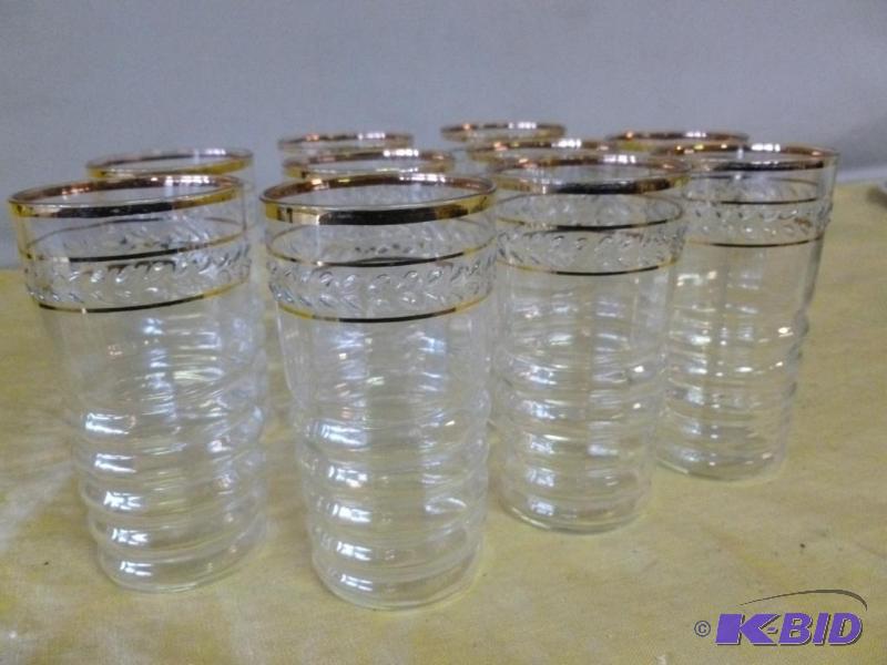 lot 200 image: A set of ten gold rimmed glasses that measure...
