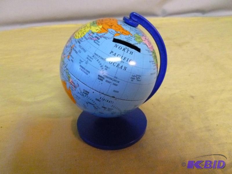 lot 220 image: Collectible metal world coin bank....