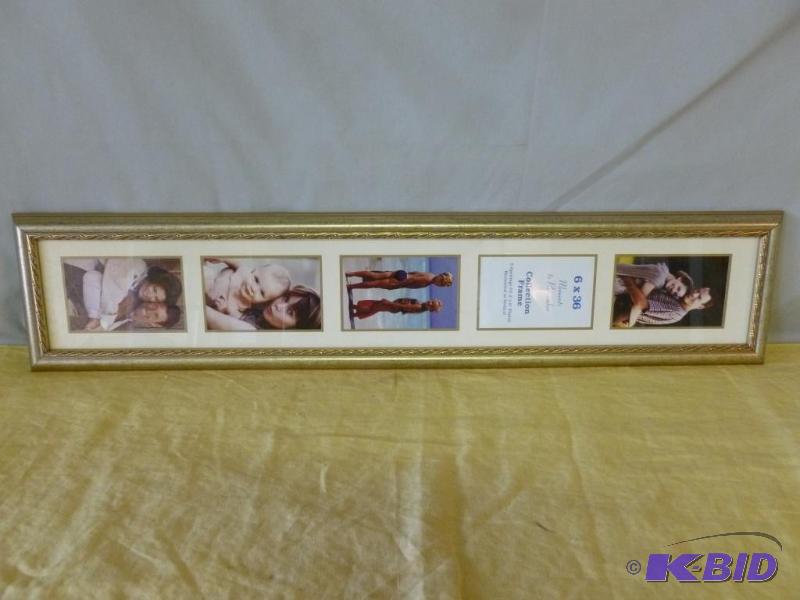 lot 24 image: Large wood framed picture frame that measures...
