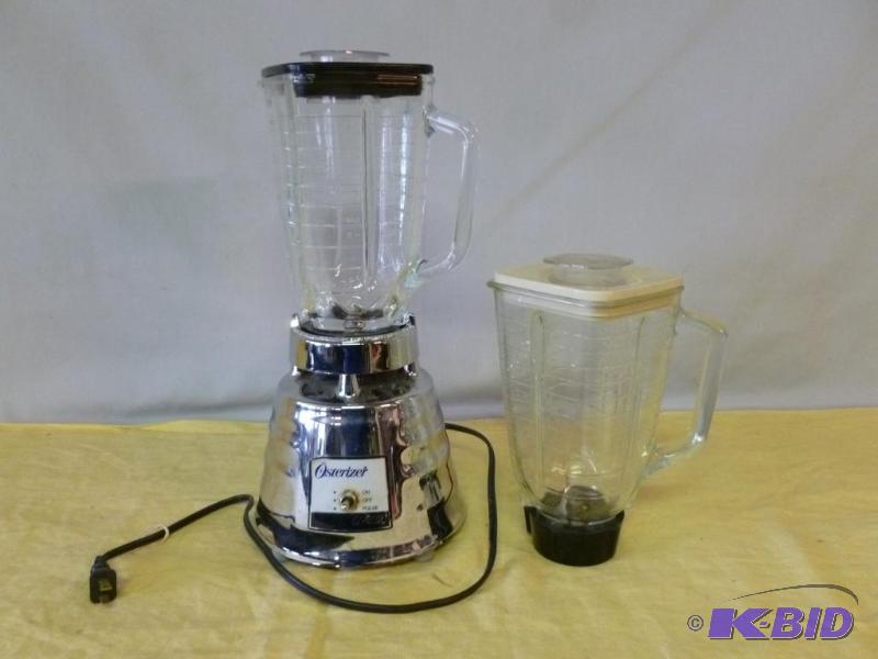 lot 57 image: Osterizer Classic blender, comes with two gla...