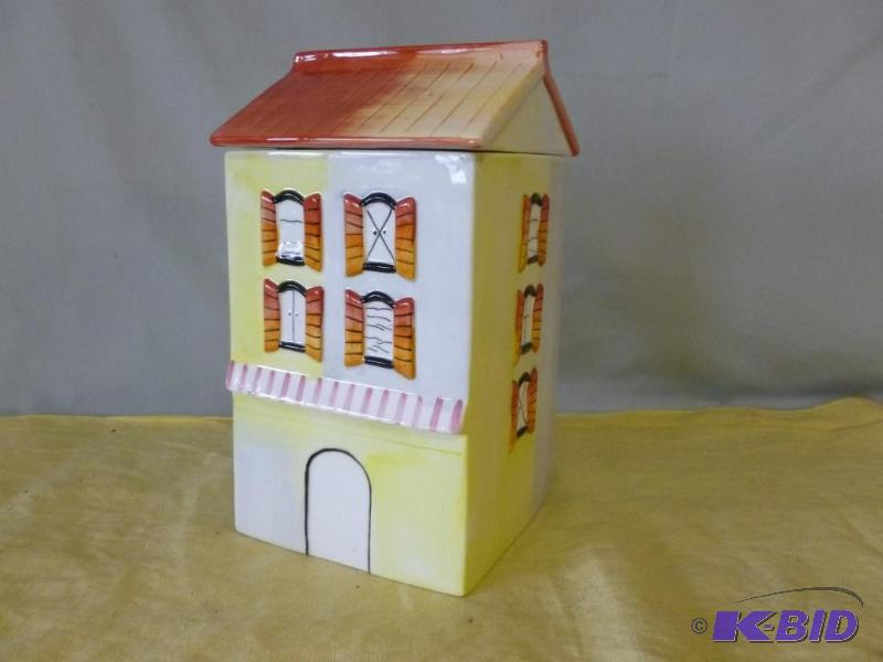 lot 69 image: Large house themed porcelain cookie jar, has ...