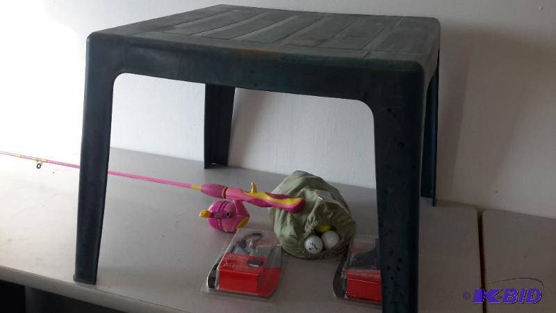 lot 15 image: Patio table, phone chargers, golf balls, barbie fishing pole, jabra