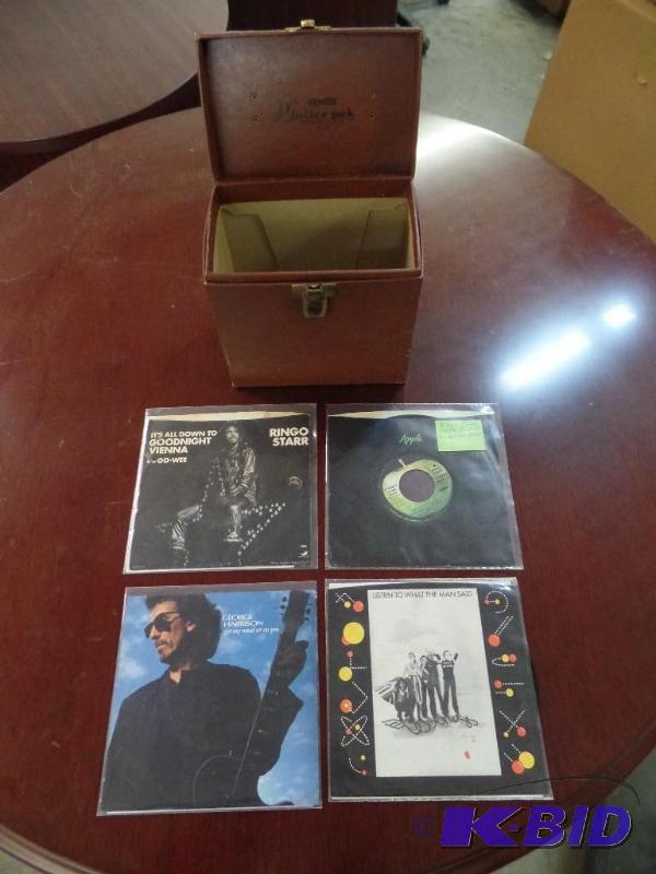lot 29 image: Four 45 rpm Records with Phonograph Record Case