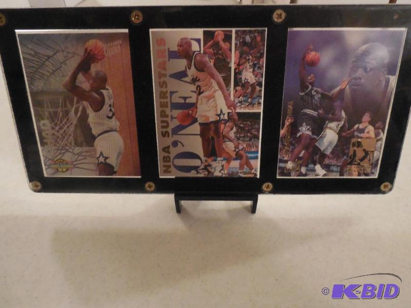 3 Shaquille Oneal cards in a plaque with a stand