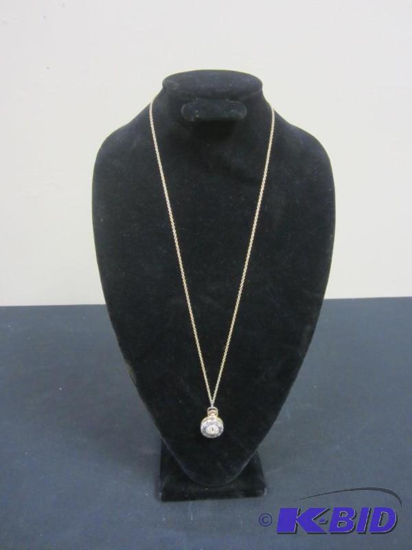 Vintage 15 inch gold tone locket necklace with sand dollar design