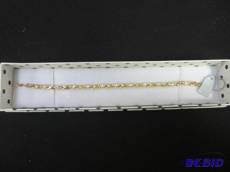 Gold Tone X & O Bracelet with Stones