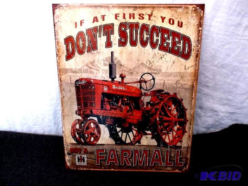 lot 21 image: Collectable Farmall sign measuring 12 12&quo...