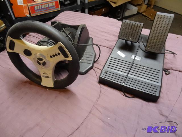 lot 101 image: Interact Concept 4 racing wheel  pedal set 1...
