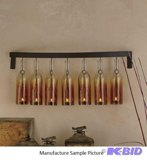 lot 4 image: Bottle Sconce - Seven amber bottles, each wit...