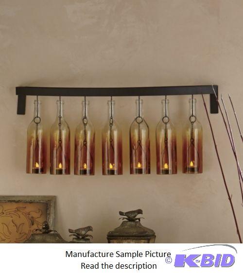 lot 93 image: Bottle Sconce - Seven amber bottles, each wit...