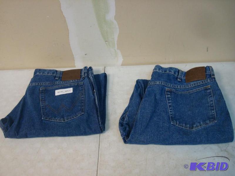 lot 174 image: Two Pairs Wrangler Rugged Wear Jeans Like New...