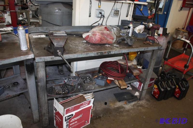 lot 24 image: Metal Work Table w2 Shelves 28 x 60 x 39 Contents Not Included.