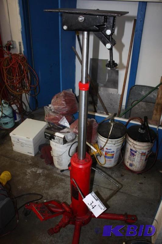 lot 34 image: Torin Big Red Jack 1000Lbs Double Ram Transmission Jack.