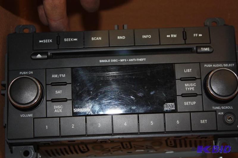 lot 474 image: Radio DVDCD Changer For CarsTrucks MP3 Capable Screw Mounts.