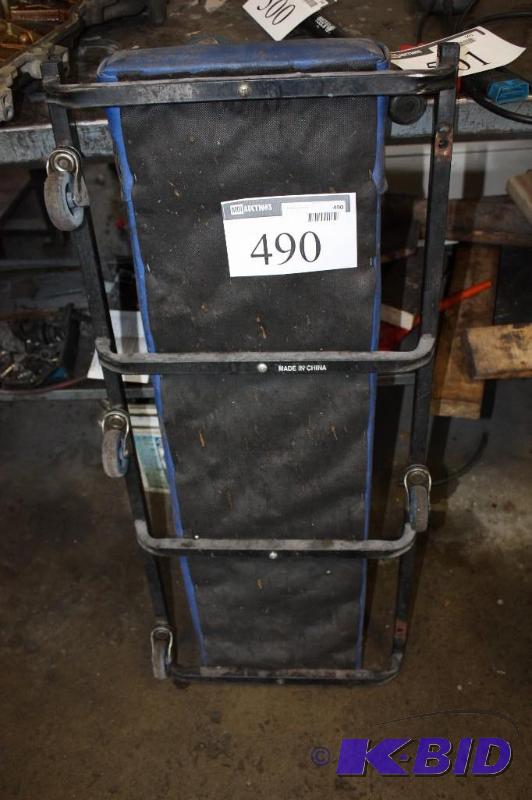 lot 490 image: Carquest Car Dolly w6 Wheels & Matted Backing wHead Rest.