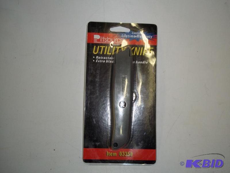 lot 12 image: New in the Package Utility Knife...