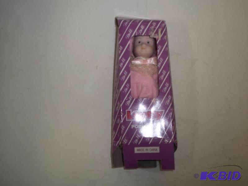 lot 180 image: Small Porcelain Doll...