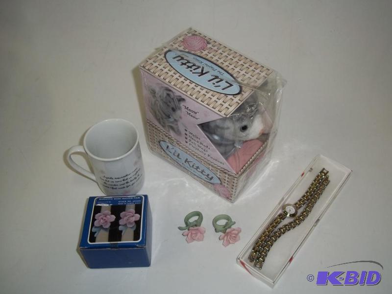 lot 237 image: Watch, coffee cup, document holder and Toy li...