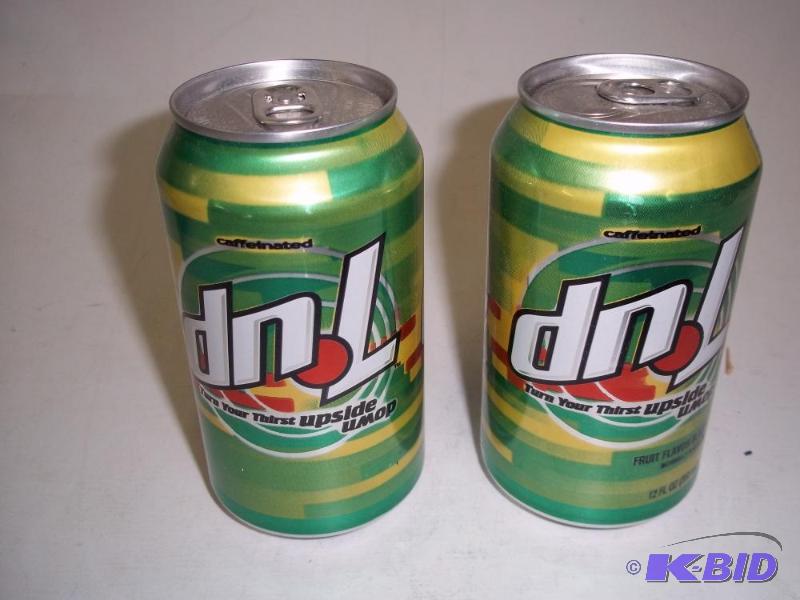 lot 61 image: 2 Upside down 7-UP Cans, full...