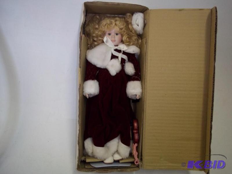 lot 99 image: 16" Porcelain doll Christmas Melody Doll...