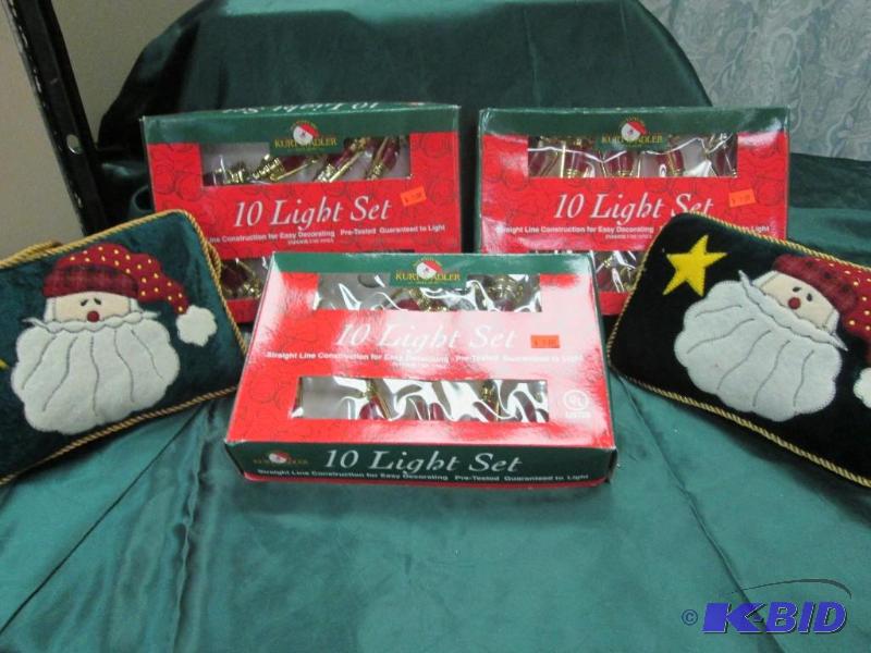 3 boxes of decorative lights, 2 santa pillows...