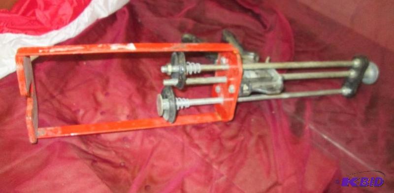 Double barrel caulking gun...