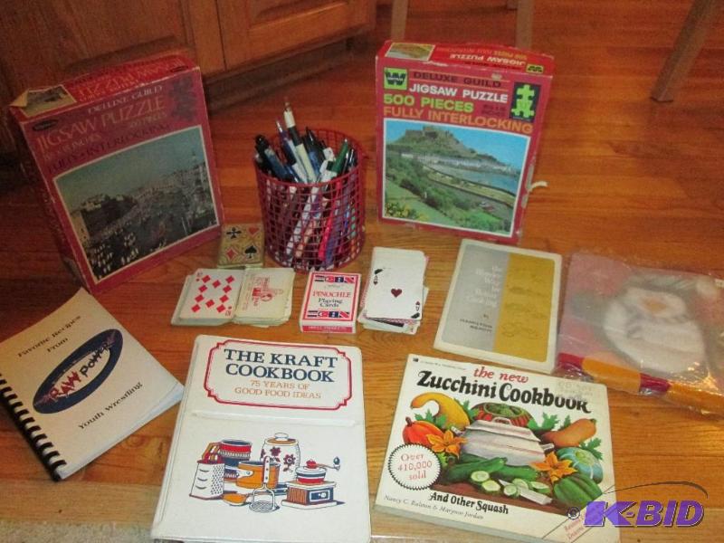 Lot of cook books, playing cards, puzzles pen...